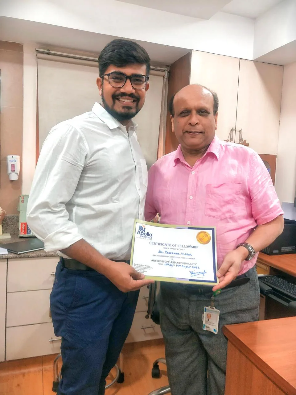 Dr. Prasanna Shah presenting a certificate